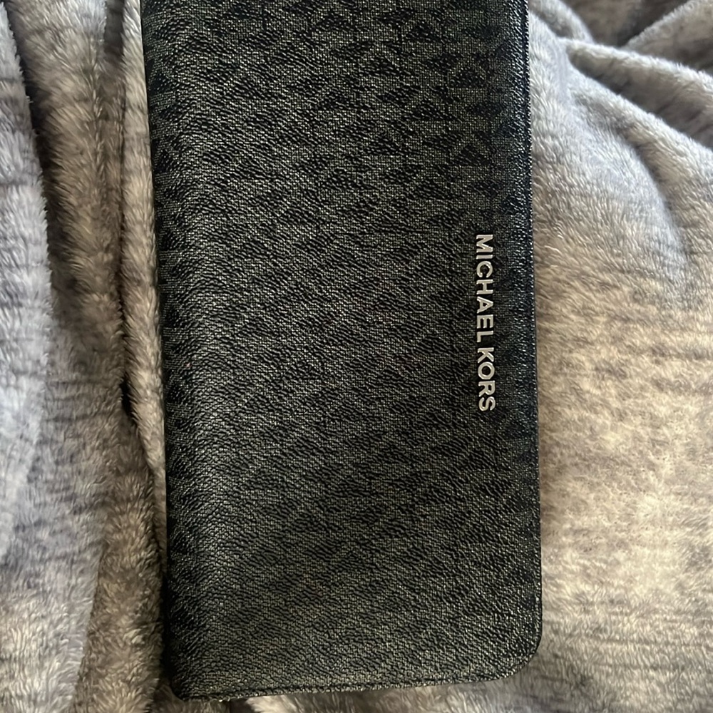 Michael Kors.travel wallet. Many card slots